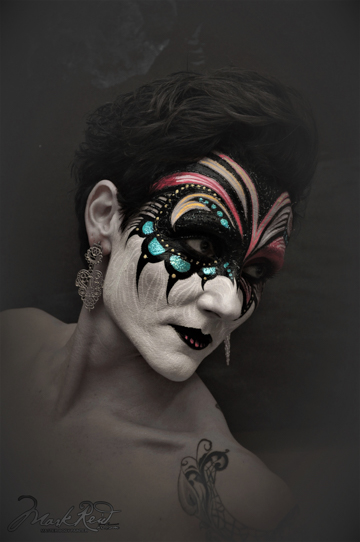 Monique Lilly, another renoun face and body painter, in a painted on mask that is very intricate
